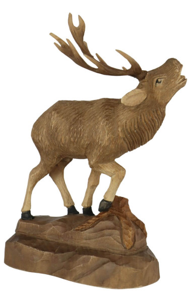 Stag with raised leg, carved, 25 cm by Schnitzkunst aus dem Erzgebirge